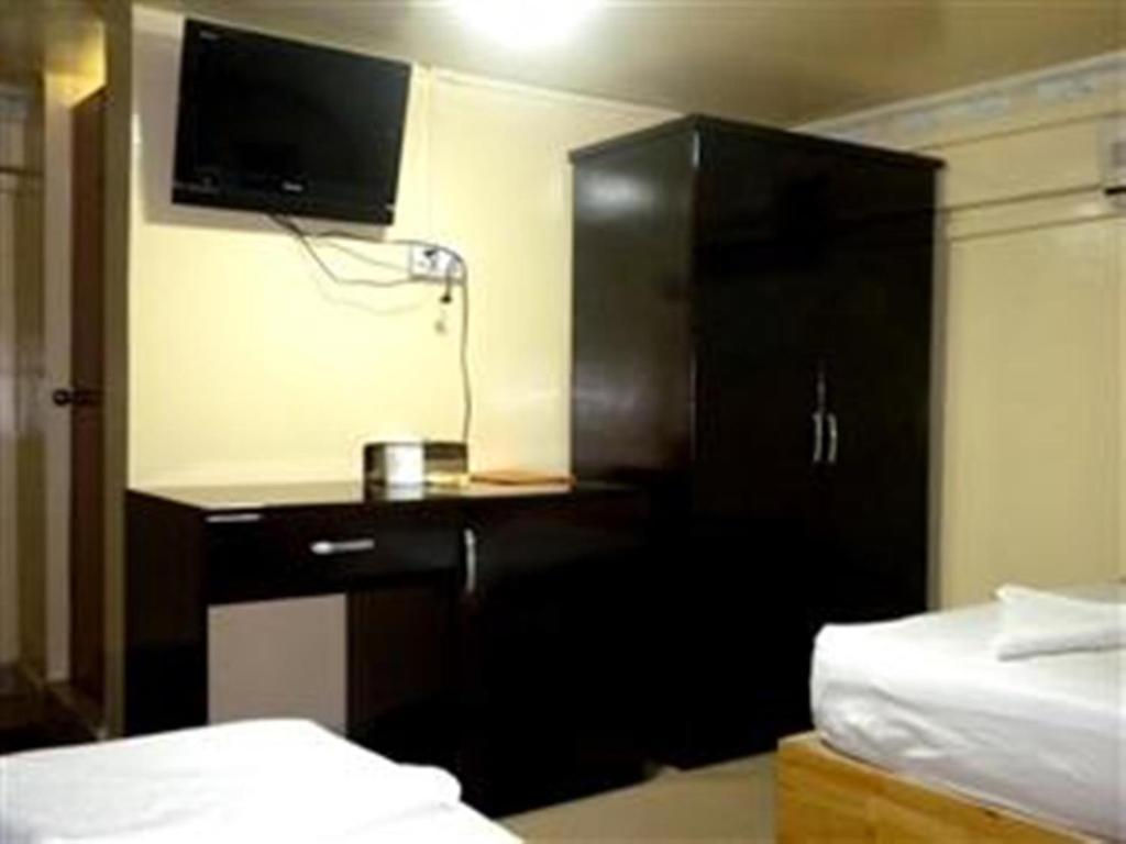 Golden Boat Guesthouse พนมเปญ ห้อง รูปภาพ